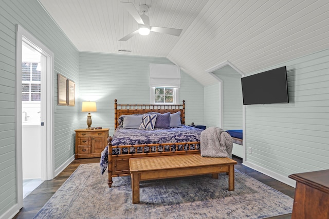 bedroom with ceiling fan, dark wood-type flooring, multiple windows, and vaulted ceiling