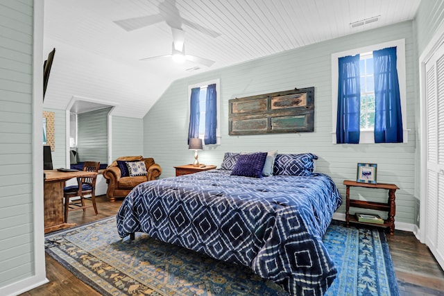 bedroom with lofted ceiling, ceiling fan, dark hardwood / wood-style floors, wood ceiling, and a closet