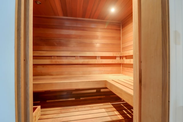 view of sauna featuring hardwood / wood-style flooring