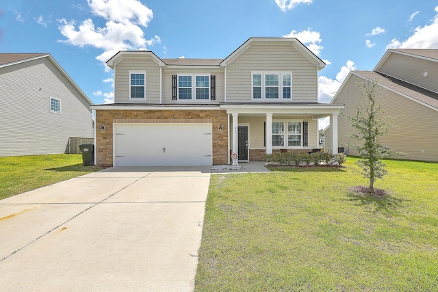 view of front of property featuring a front lawn, covered porch, and a garage