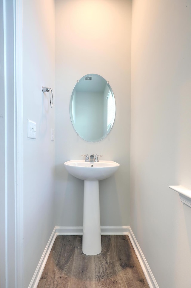 bathroom featuring hardwood / wood-style flooring