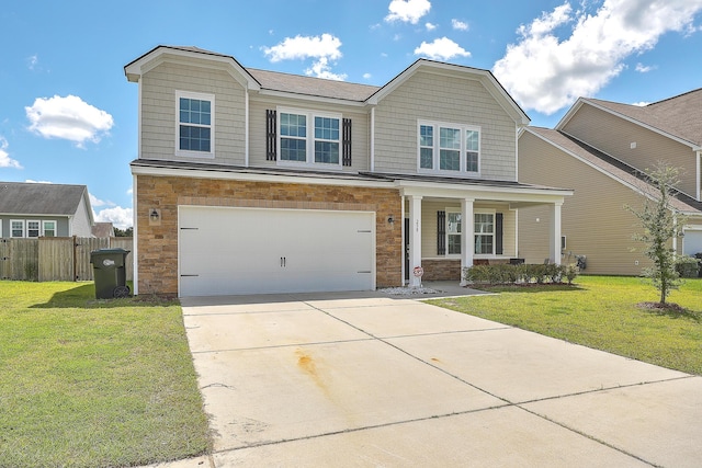 view of front of property featuring covered porch, a garage, and a front yard