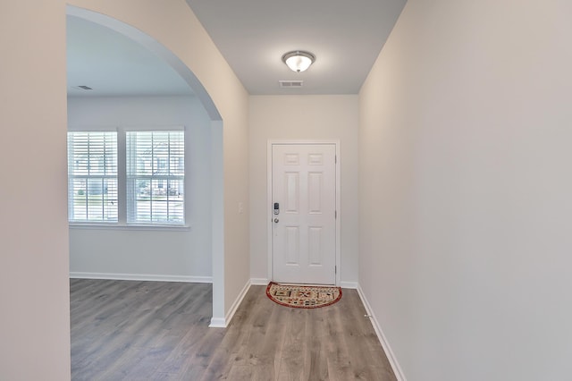 doorway with hardwood / wood-style floors