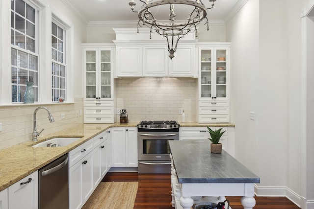 3221 Johnstowne St, Johns Island, SC 29455 - kitchen featuring appliances with stainless steel finishes, a chandelier, white cabinetry, dark wood-type flooring, and ornamental molding