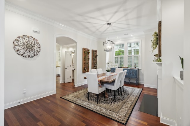 3221 Johnstowne St, Johns Island, SC 29455 - dining room featuring arched walkways, dark wood finished floors, ornamental molding, and a chandelier