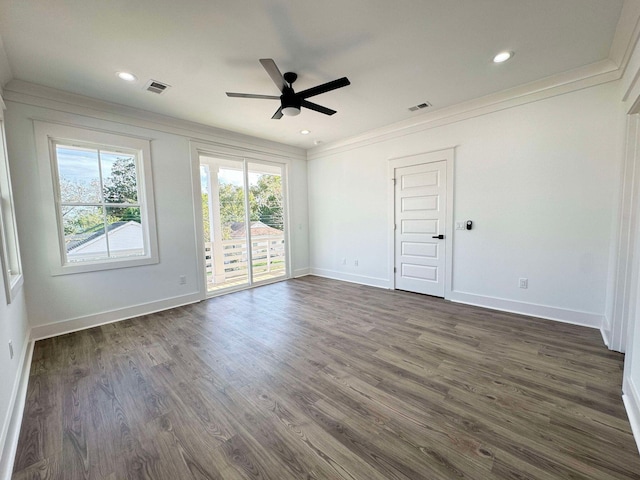 unfurnished room with ceiling fan, crown molding, and dark wood-type flooring