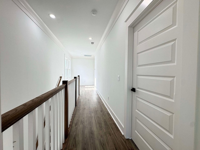 hall with dark hardwood / wood-style floors and ornamental molding