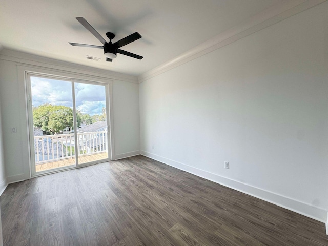 empty room featuring ceiling fan, dark hardwood / wood-style flooring, and crown molding