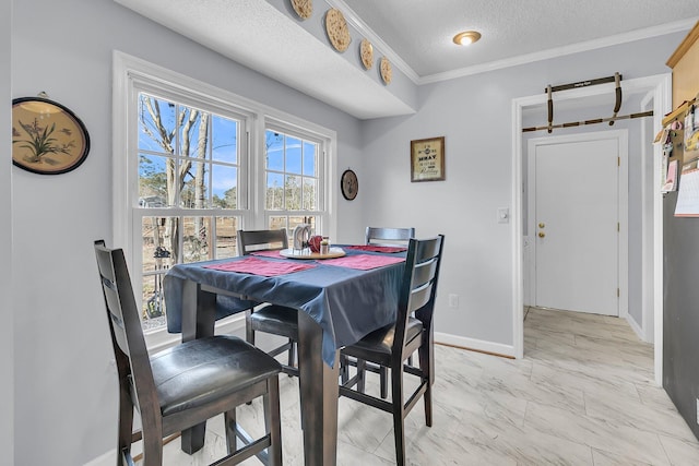 dining space with a textured ceiling and ornamental molding