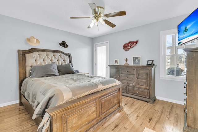 bedroom with light wood-type flooring and ceiling fan