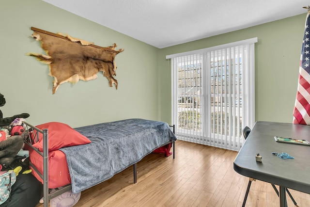 bedroom featuring hardwood / wood-style flooring