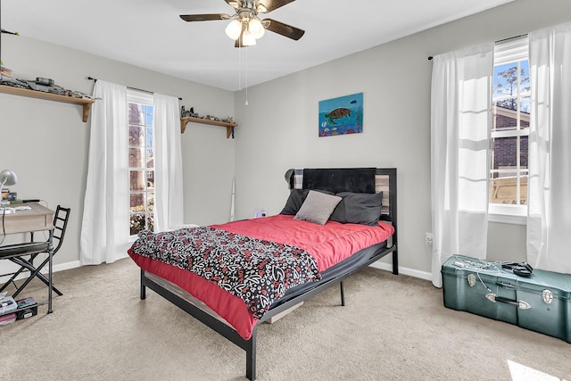 bedroom with multiple windows, carpet flooring, and ceiling fan