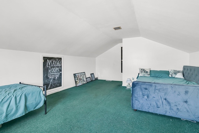 carpeted bedroom featuring lofted ceiling