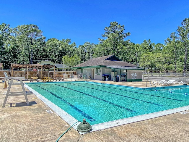 view of swimming pool with a patio