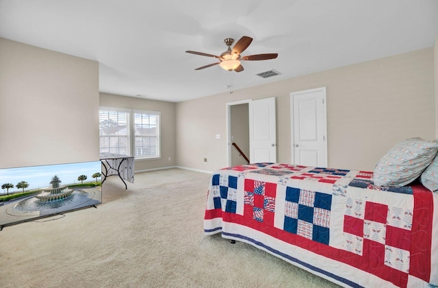 bedroom featuring carpet, visible vents, ceiling fan, and baseboards