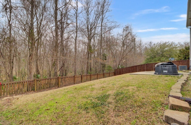 view of yard featuring a patio area and a fenced backyard