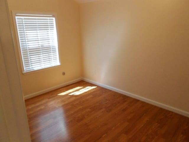 spare room featuring hardwood / wood-style floors