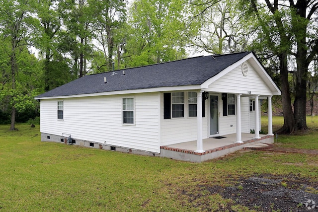 exterior space with a patio area and a yard