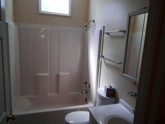 full bathroom featuring shower / washtub combination, toilet, and vanity