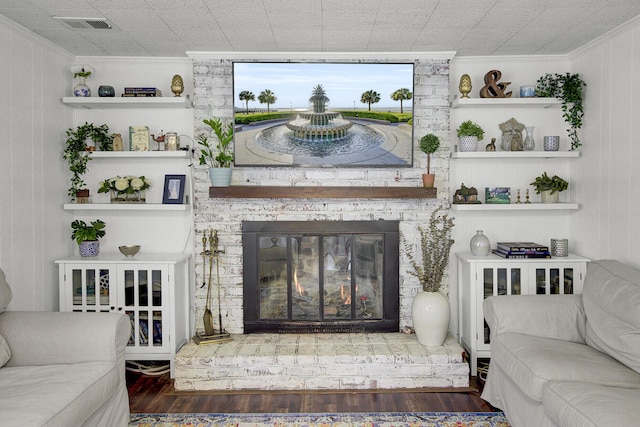 1032 Windward Rd, Charleston, SC 29412 - living area featuring crown molding, wood finished floors, and a brick fireplace