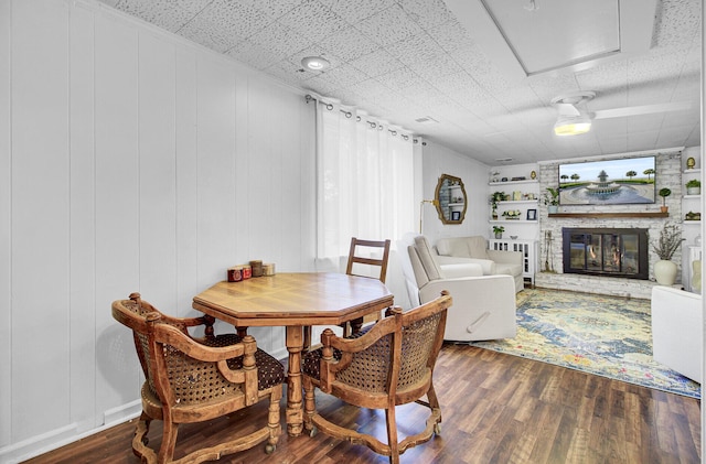 1032 Windward Rd, Charleston, SC 29412 - dining area featuring wood finished floors and a large fireplace