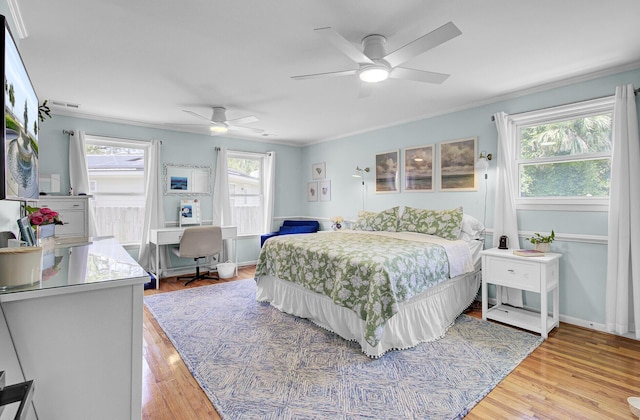 1032 Windward Rd, Charleston, SC 29412 - bedroom with crown molding, a desk, light wood-style floors, and ceiling fan