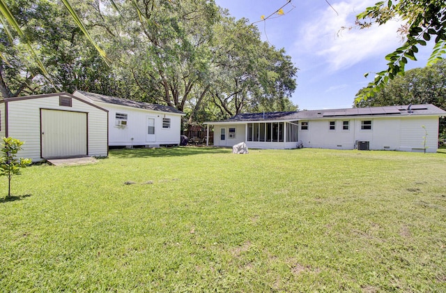 1032 Windward Rd, Charleston, SC 29412 - view of green lawn with a storage unit and a sunroom