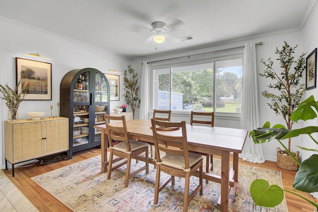 1032 Windward Rd, Charleston, SC 29412 - dining area with ornamental molding, ceiling fan, and light wood-style flooring