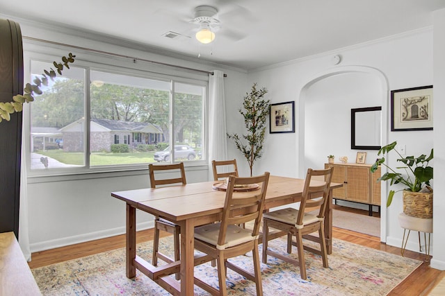 1032 Windward Rd, Charleston, SC 29412 - dining space with ornamental molding, ceiling fan, light wood-style flooring, and arched walkways