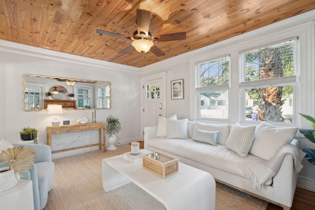 carpeted living room with ceiling fan, ornamental molding, and wooden ceiling