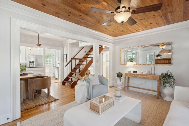 living room with crown molding, ceiling fan, wooden ceiling, and light wood-type flooring