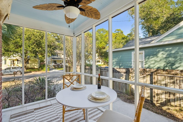 sunroom with ceiling fan and plenty of natural light