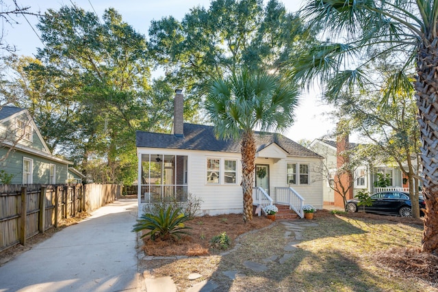 view of front of home with a sunroom