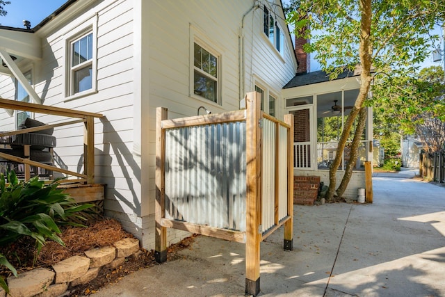 view of property exterior with a patio