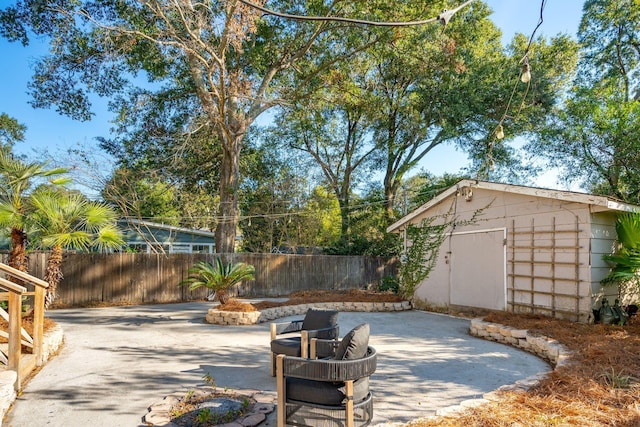 view of patio / terrace featuring a shed