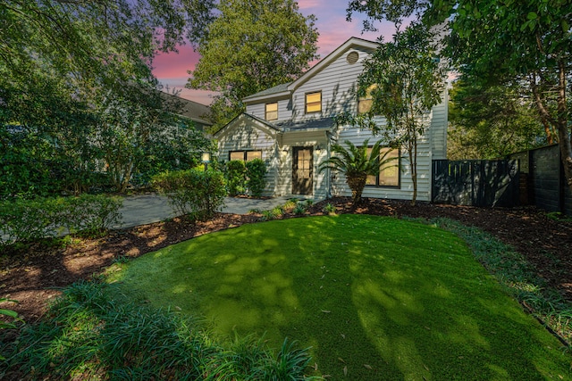 view of front of home featuring a yard