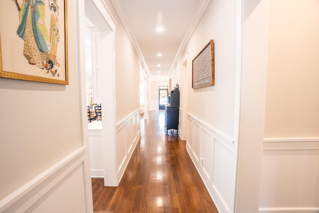 1566 Lindsey Creek Dr, Mount Pleasant, SC 29466 - hallway featuring ornamental molding, a decorative wall, a wainscoted wall, and dark wood-style flooring
