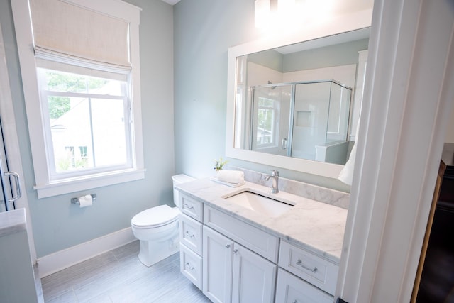 1566 Lindsey Creek Dr, Mount Pleasant, SC 29466 - bathroom with a shower stall, baseboards, vanity, and toilet