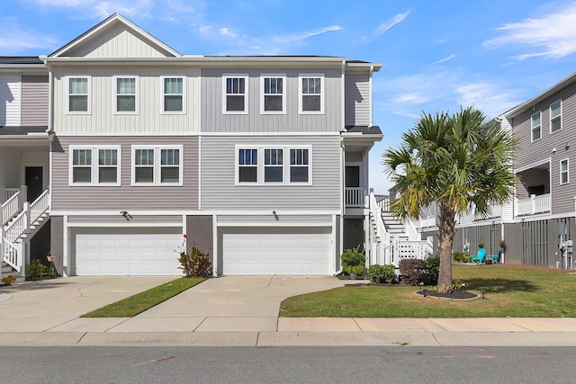 view of front of home with a garage and a front yard