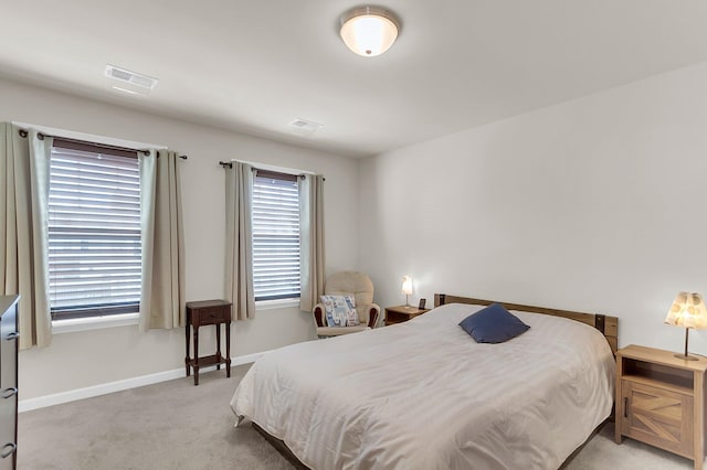 bedroom with light colored carpet