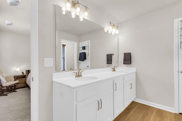 bathroom featuring hardwood / wood-style flooring and vanity