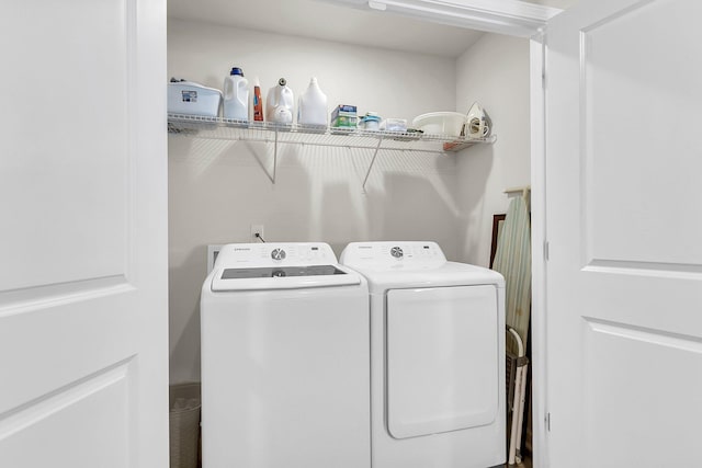 laundry room featuring washing machine and dryer