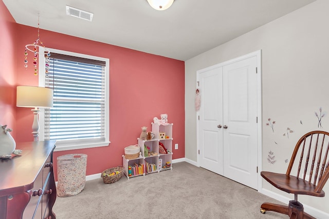 recreation room featuring light colored carpet