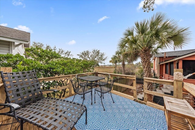 wooden deck with outdoor dining area