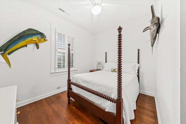 bedroom featuring a ceiling fan, visible vents, baseboards, and wood finished floors