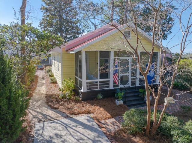 view of front facade featuring a sunroom