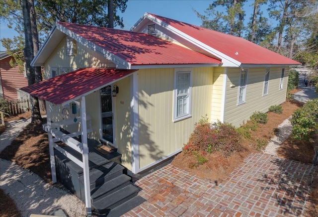 view of property exterior with metal roof