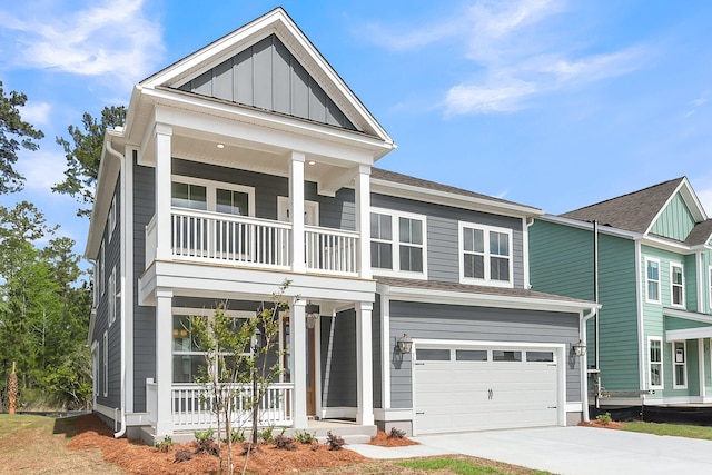 view of front of property featuring covered porch, a balcony, concrete driveway, board and batten siding, and an attached garage