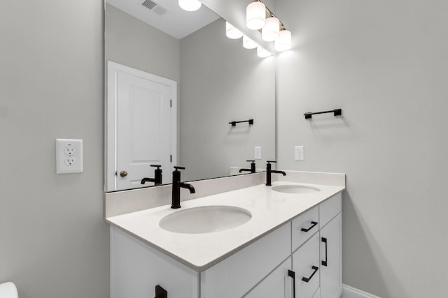 bathroom featuring double vanity