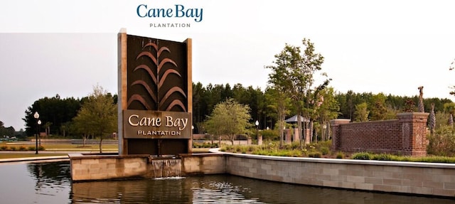 community sign with a water view